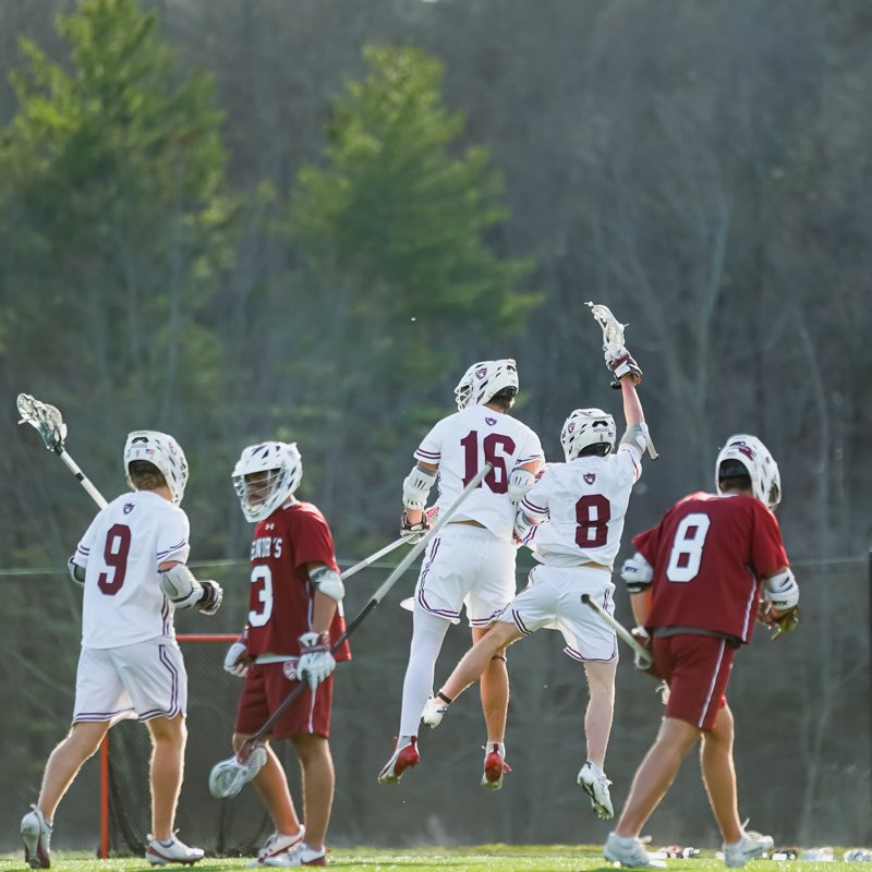 Lacrosse players leaping in celebration